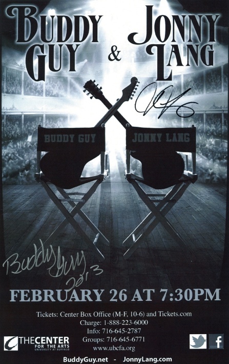 image of two guitars placed in director chairs.