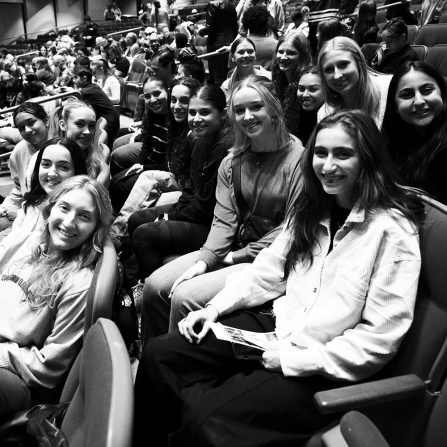 students sitting in the audience during a dance masterclass.