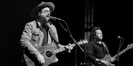 michael glabicki and dirk miller performing on the drama theatre stage.