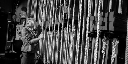 student working on the mainstage fly-tlower.