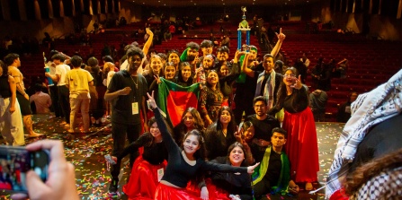 student performers on stage for international fiesta.