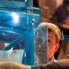 Student and facutly working on stage building. 