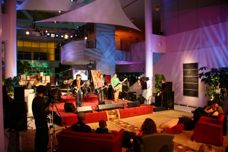 Zoom image: Scene of a band playing in the Center for the Arts from Music is Art Live at the Center.