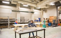 A student fabricates a set piece in the scene shop. 