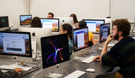 Students using iMacs. 