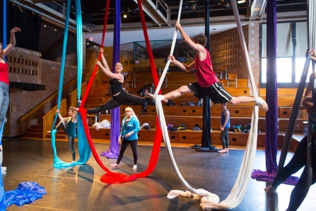 Katherine Cornell Theatre, students performing with aerial ropes and fabrics suspended from the ceiling. 