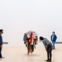 students viewing work in an art gallery. 
