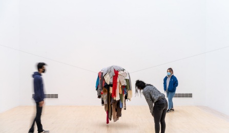 students viewing work in an art gallery. 