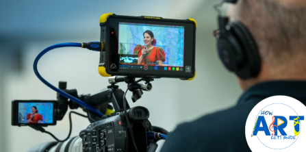 view of artist speaking through camera screen.