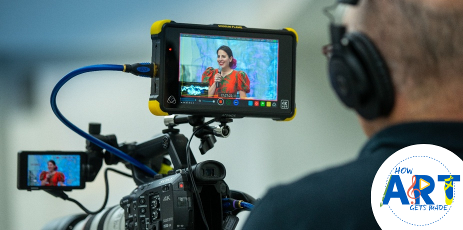 view of artist speaking through camera screen. 