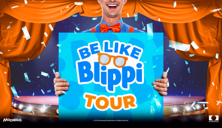 blippi holding a sign with event name in front of a cartoon stage. 