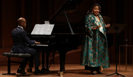 Karen Slack and Kevin Miller performing on stage. 