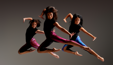 three dancers suspended in air. 
