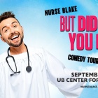 nurse blake wearing a white gown in the sky with a stethoscope around his neck. 