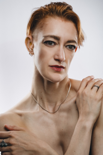 jillian davis without a shirt with arms crossed in front of body. 