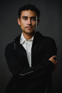 miquel solano posing with arms folded. 