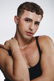 angelo de serra posing with hand on neck. 