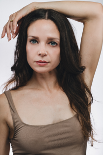 chloe duryea posing with arm over head. 