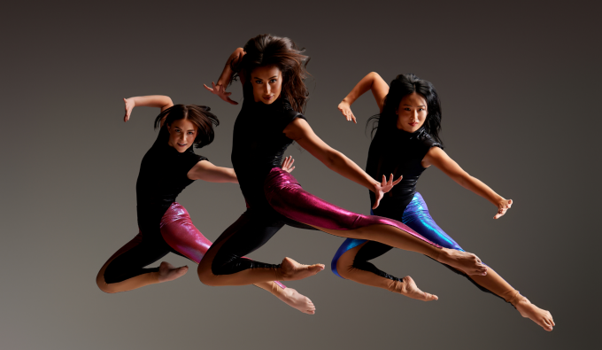 three dancers suspended in air.