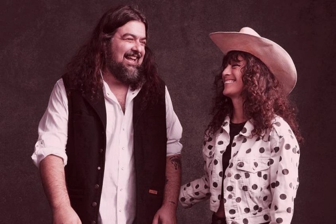 Samoa Wilson and Sean Walsh looking at each other and smiling. 