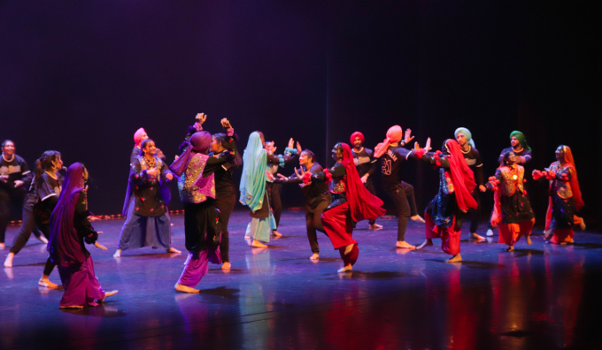 students performing on stage at internatinoal fiesta. 